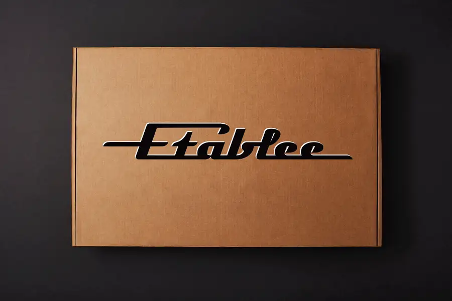 Animation: the Etablee E01 box opens, the parts come out and the bench is assembled step by step until the white top sits in place