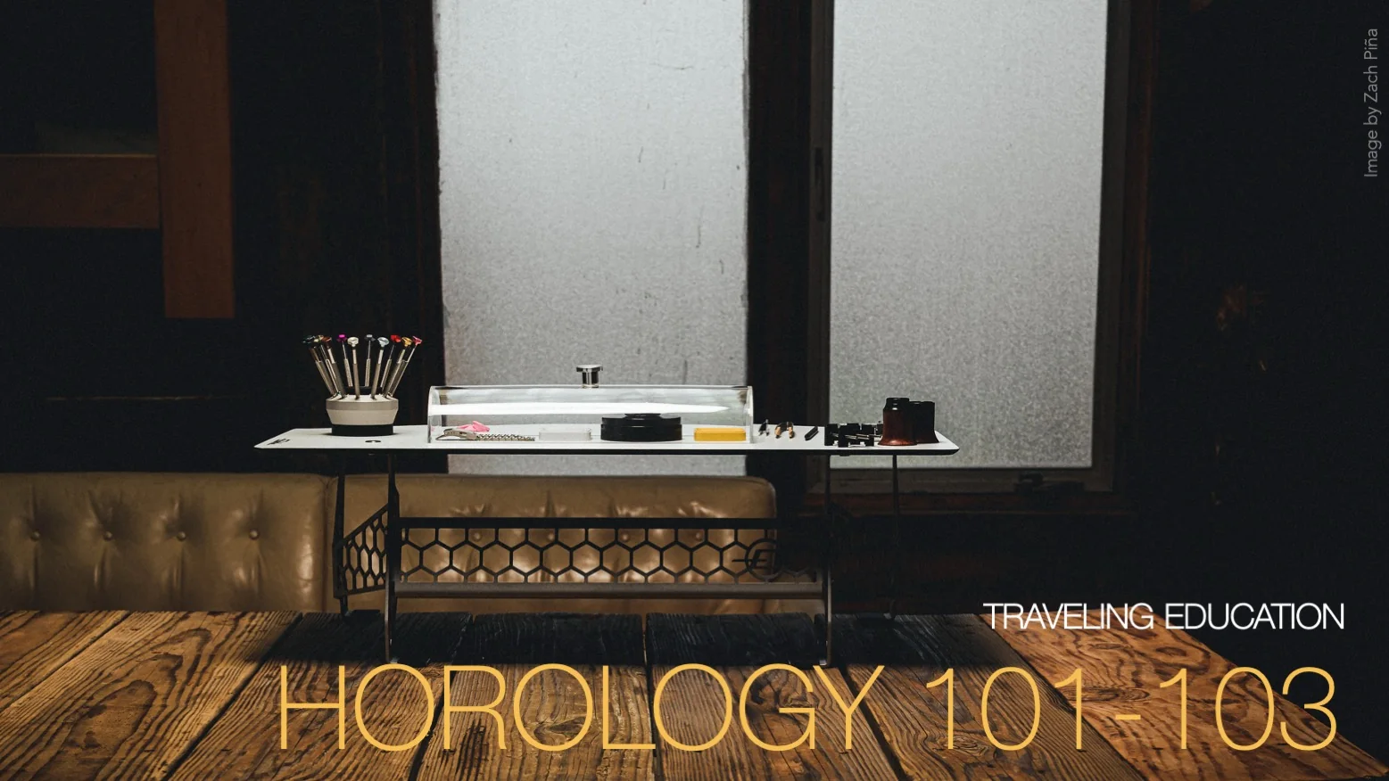 Horology 101 to 103, Traveling Education: a portable watchmaking bench with tools, movement holder and dust cover, set up on a wooden table